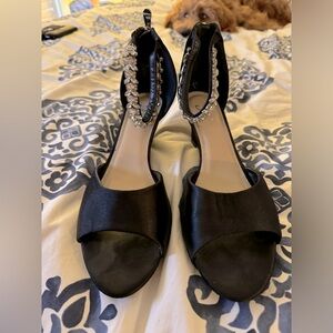 Black heels with embellished ankle strap